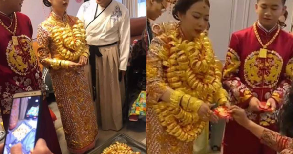 Đeo cả trăm cây vàng trên người, vali của hồi môn cũng đựng kín, cô dâu mệt mỏi cho biết: “Đeo nhiều cũng nặng thật!”